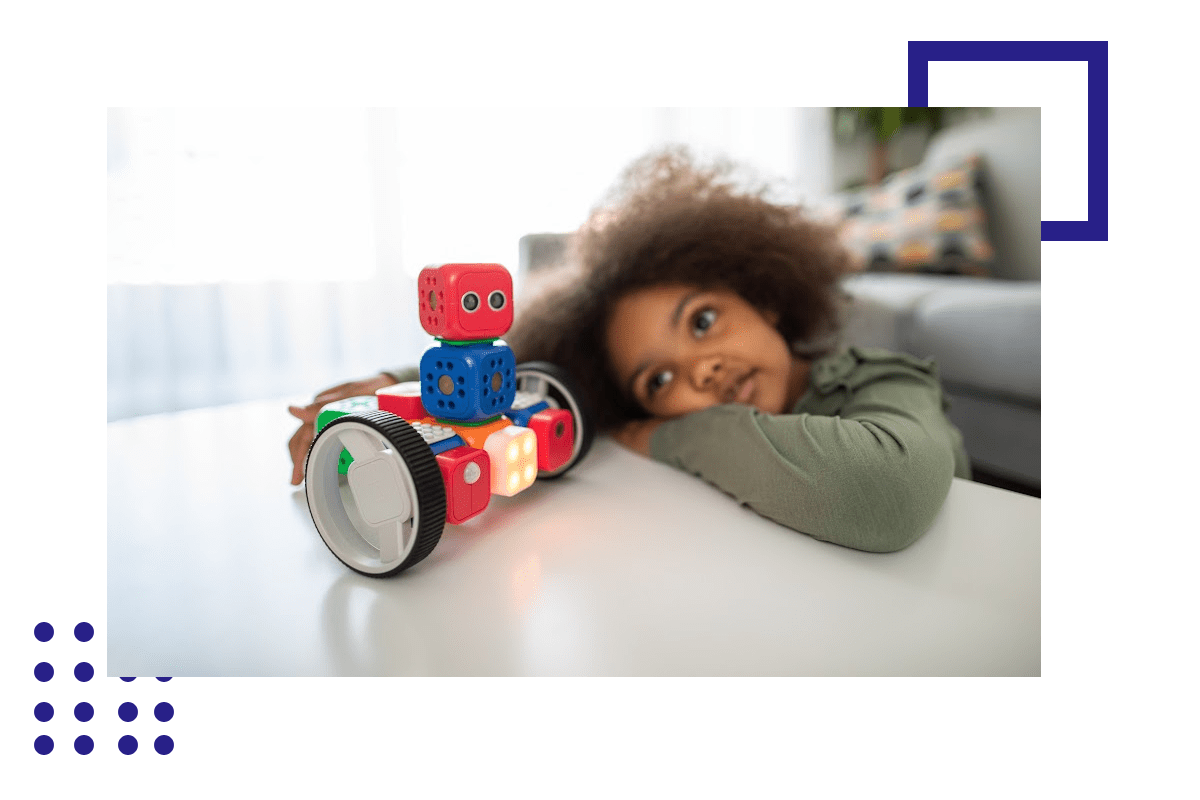 A child is playing with a robot toy.